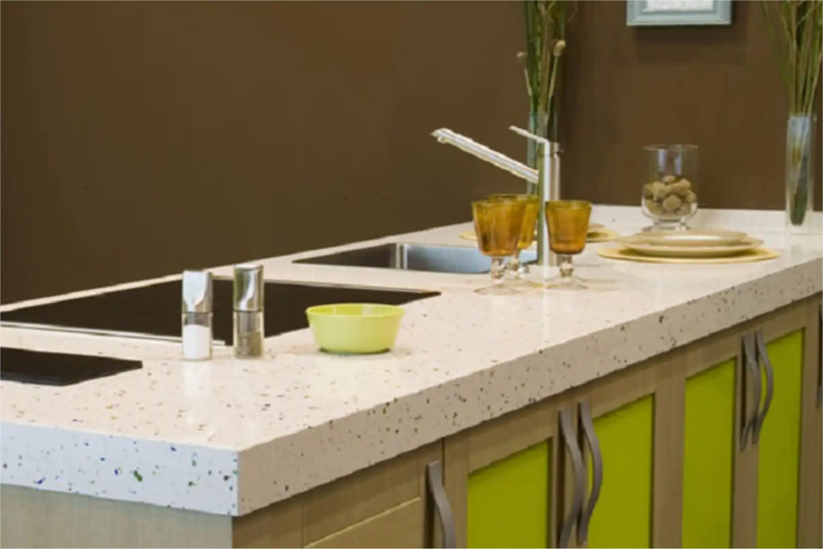 Modern kitchen with white terrazzo worktop and green cabinets