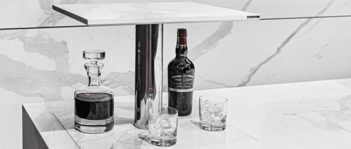Flooring Laminam Bianco Statuario Venato countertop with wine and glasses