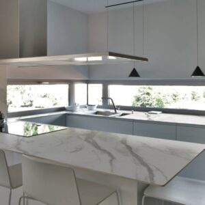 Contemporary kitchen in Surrey with Laminam Calacatta Oro Venato countertops