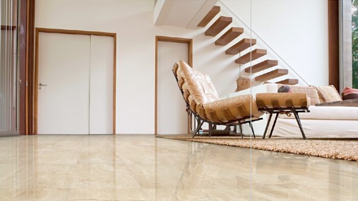 Flooring Living room with Crema Marfil Marble flooring in a modern London home.