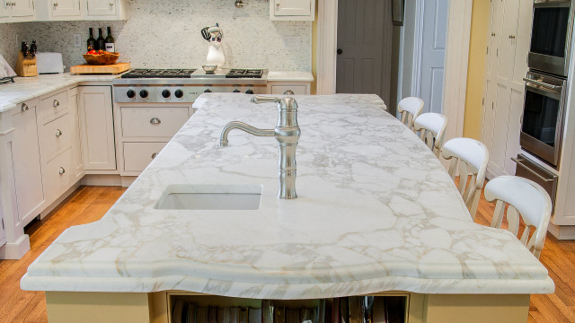 Flooring Kitchen island featuring Calacatta Oro Marble worktop