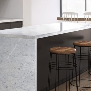 Modern kitchen island featuring Bianco Carrara Extra Marble in a bright, airy space.