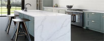 Modern kitchen with white Silestone worktop and grey cabinets