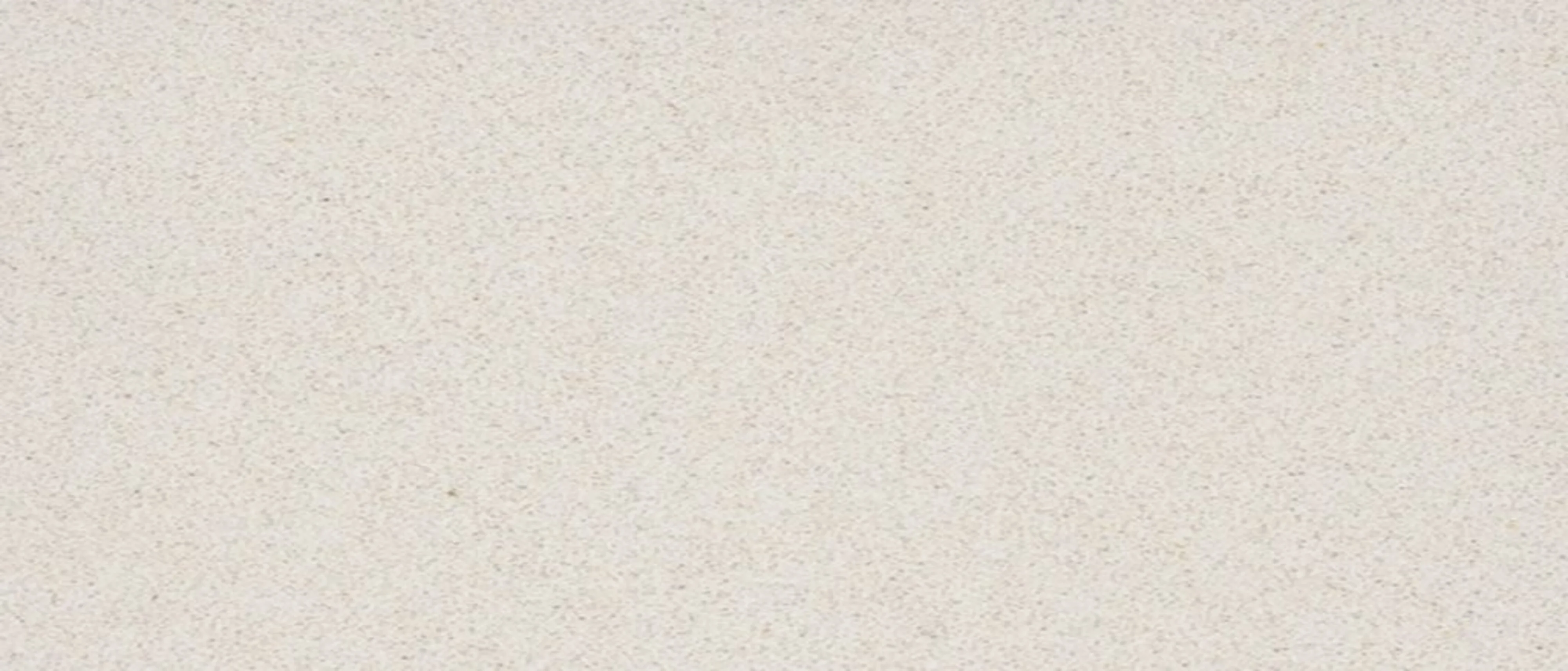 A beige quartz surface.